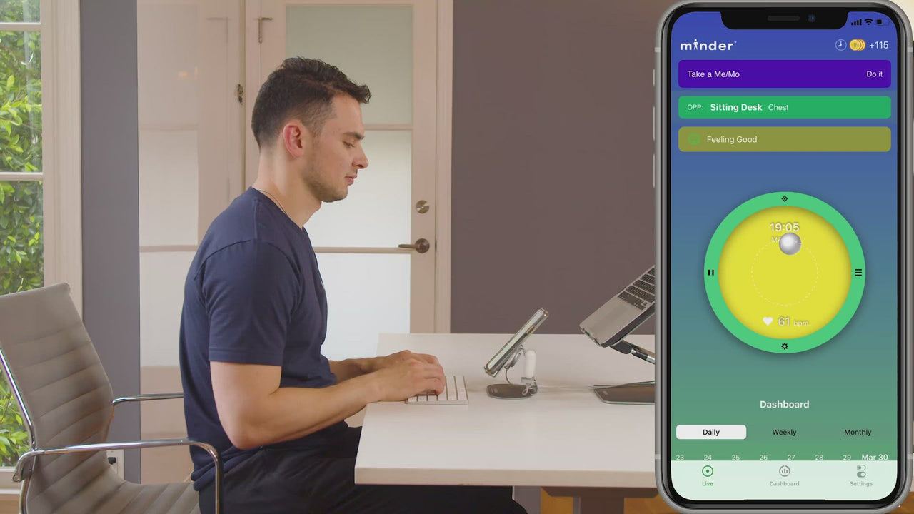 Video of someone using minder to improve posture and practice breathing. 